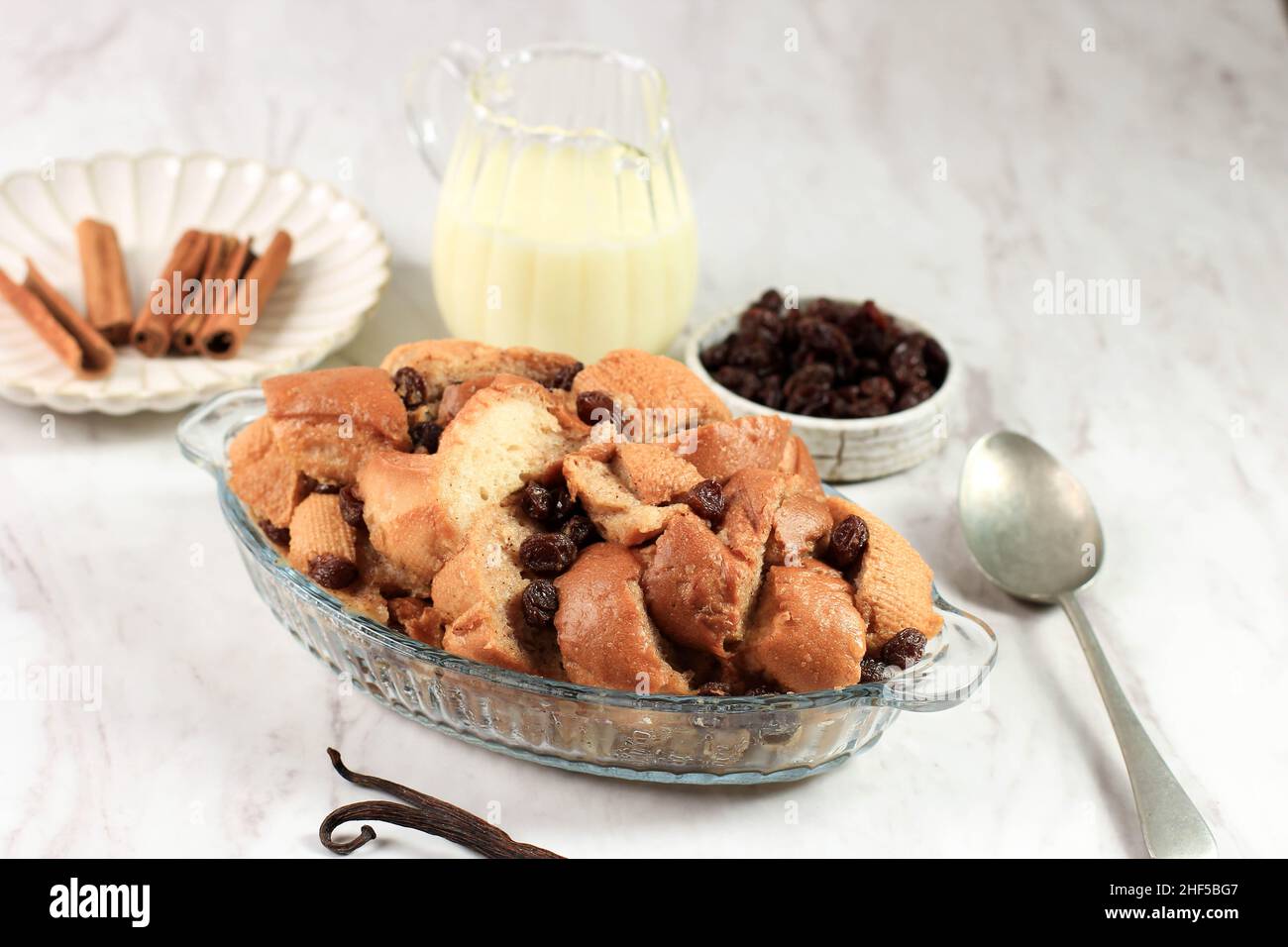 Cinnamon Bread Pudding Breakfast Casserole with Vanilla Sauce on the
