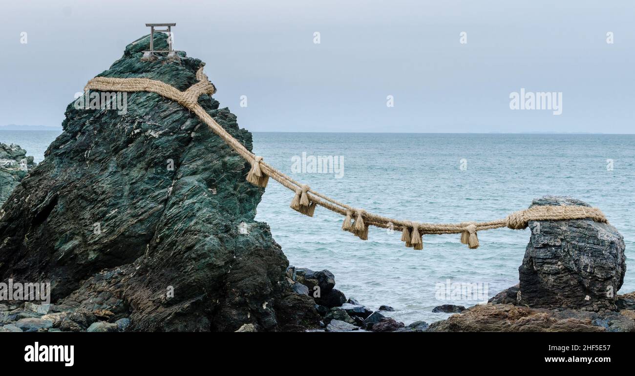 The famous Meotoiwa rocks, representing man and woman joined by a rope, on the coast of Ise, Japan Stock Photo