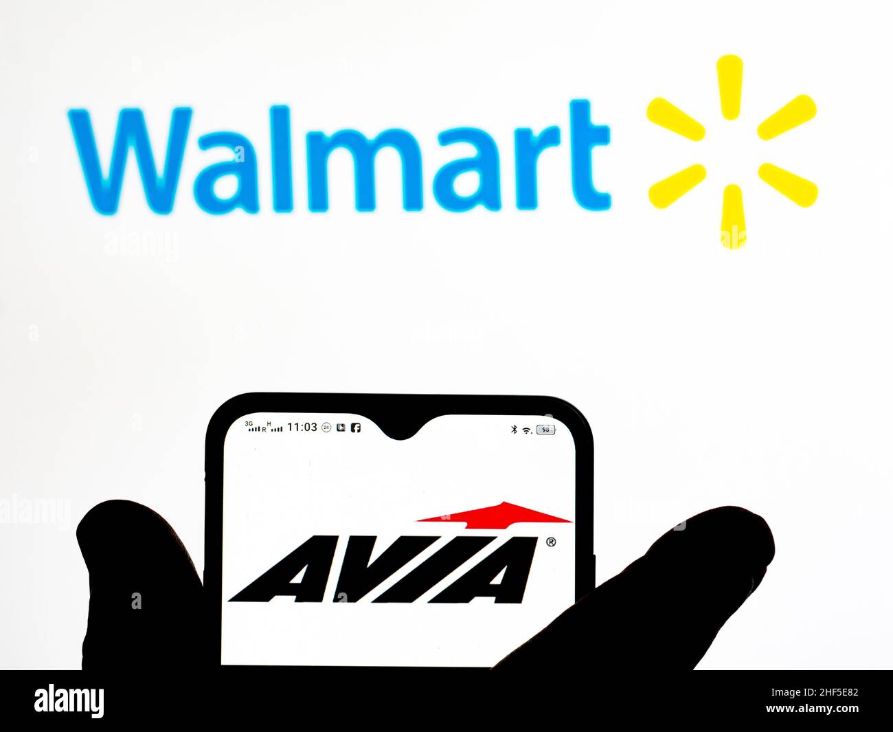 In this photo illustration, the Avia brand by Walmart logo is seen  displayed on a smartphone screen with the Walmart logo in the background  Stock Photo - Alamy