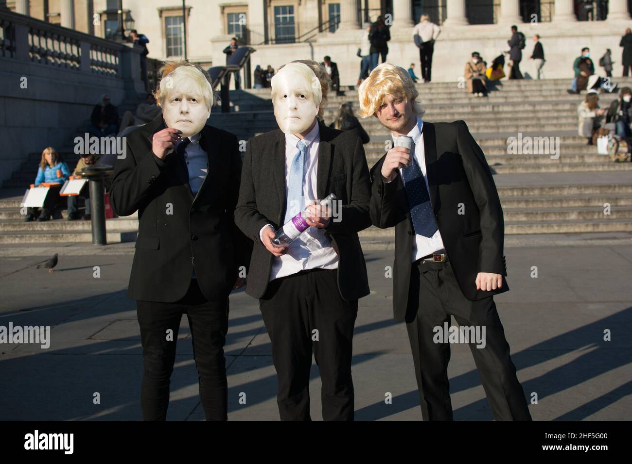 Trafalgar Square, London 15 January 2022. A group of Middle-class youngster demand Boris Johnson resignation, party during lockdown will the people suffering die and dying and not allow tio vist their family dies alone in the hospital bed or at home. Stock Photo