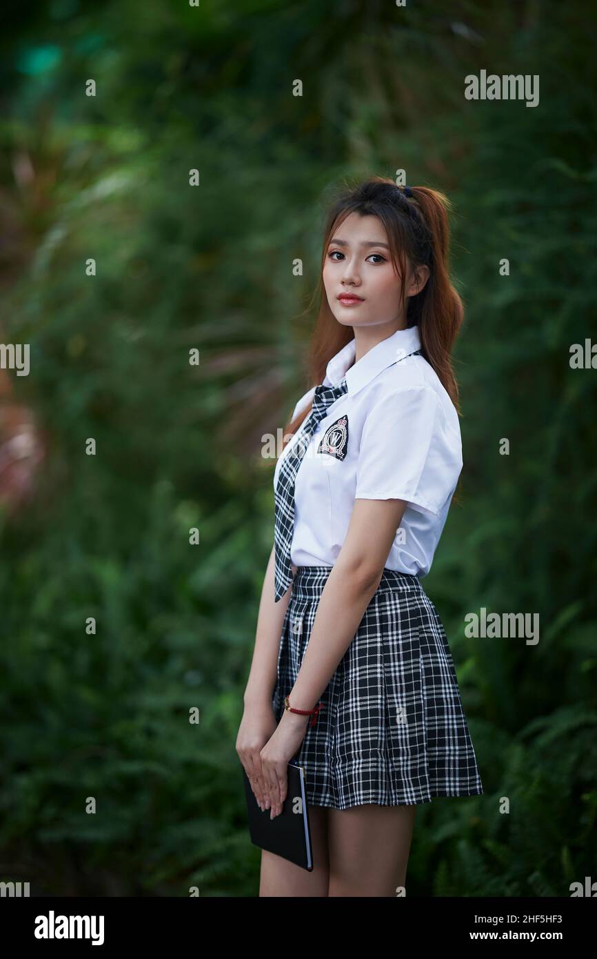 Ho Chi Minh City, Vietnam: portrait of beautiful Vietnamese girl in school uniform Stock Photo
