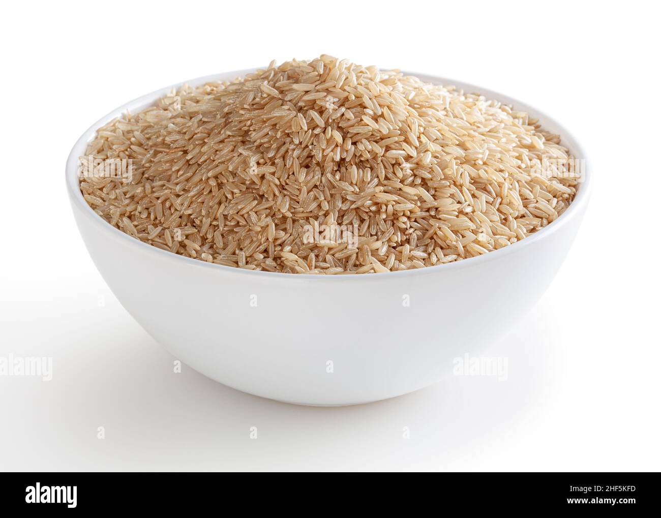 Brown rice in white bowl isolated on white background with clipping path Stock Photo