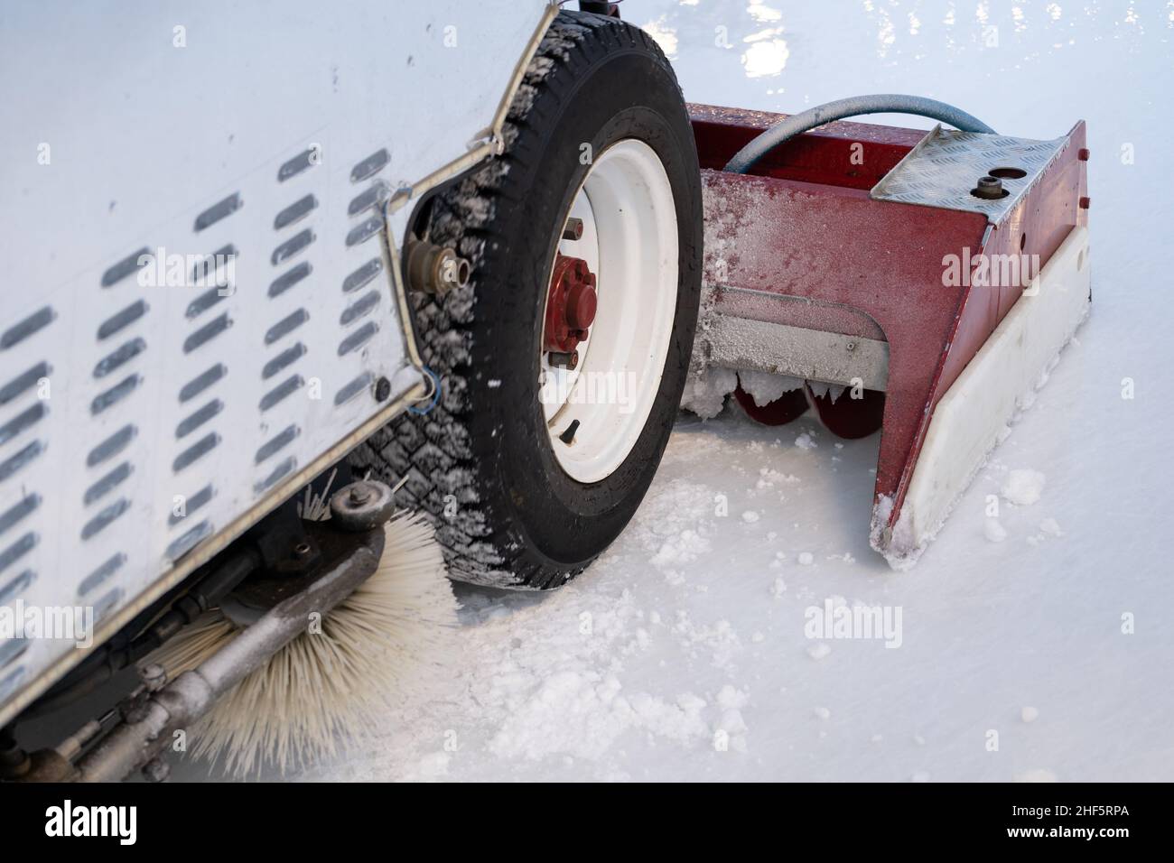 Polished ice maintenance machine ice preparation at rink between