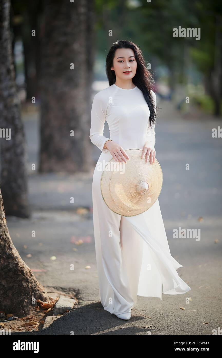 Girl in Ao Dai traditional vietnamese robe for females Ho Chi Minh