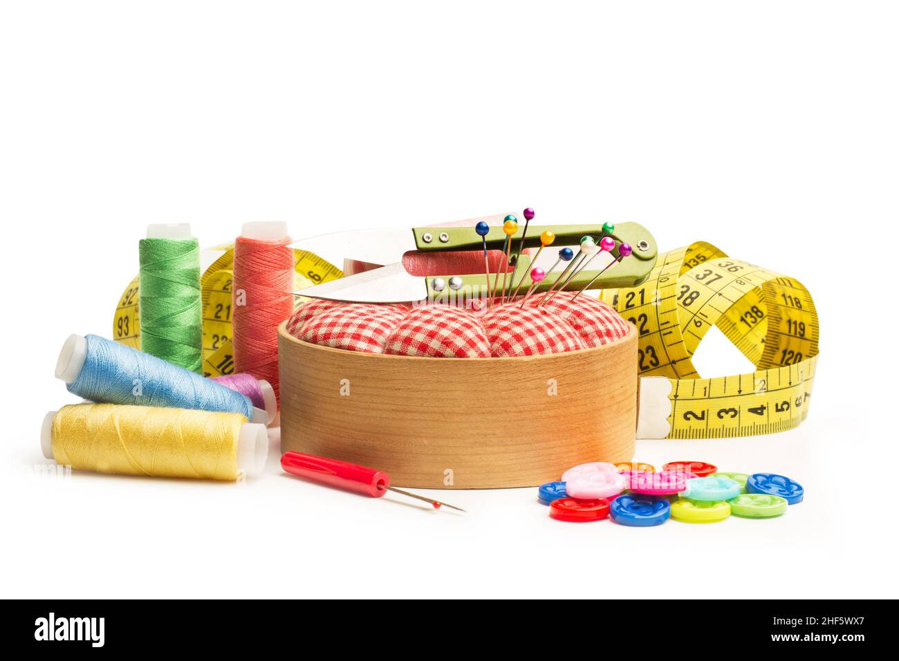 Scissors, sewing thread, buttons and sewing accessories on a white background Stock Photo