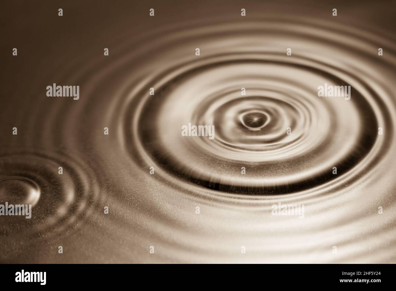 Mocha background with water and rings Stock Photo