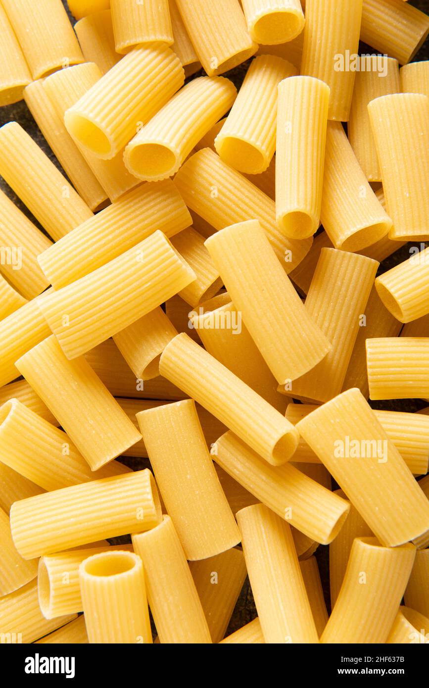 View from above and closeup of rigatoni pasta. Stock Photo