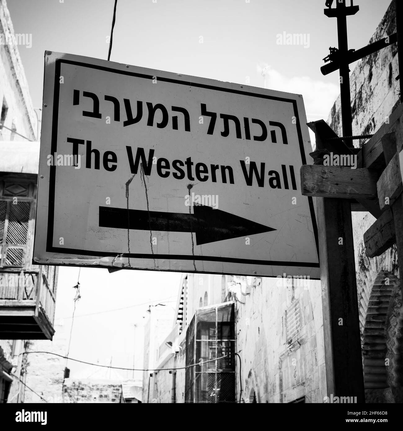 Western Wall direction sign in the street in The Old Town of Jerusalem, Israel. Black and white photography Stock Photo