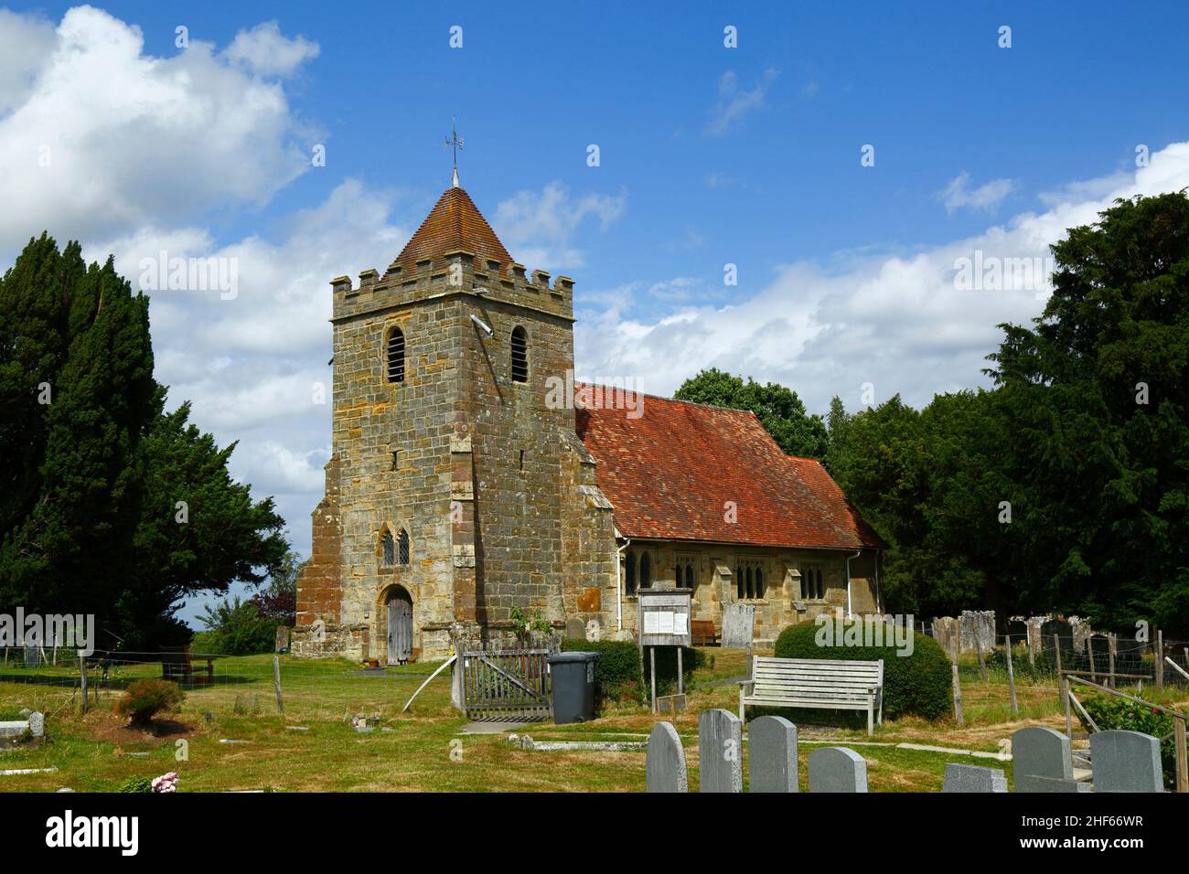 Churchyard of St Thomas a Becket church in summer, Capel, Kent, England Stock Photo