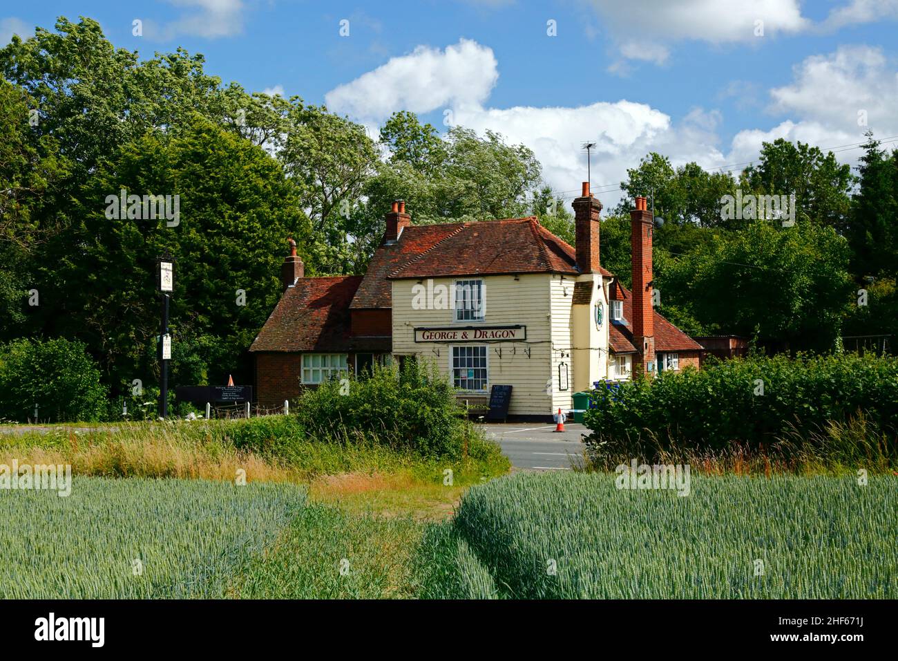 The George & Dragon At Tudeley public house on Five Oak Green Road between Tudeley and Capel, Kent, England. Field of young wheat in foreground. Stock Photo