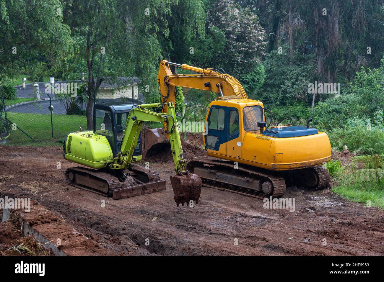 Two excavators working in Madeira island, Portugal. Stock Photo
