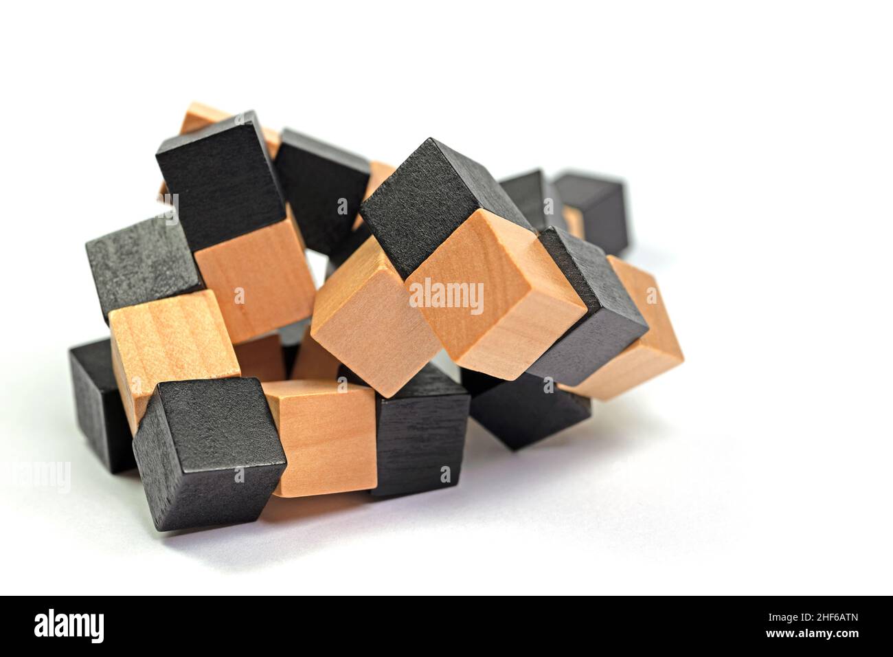 Puzzle from wooden cubes against a white background Stock Photo - Alamy