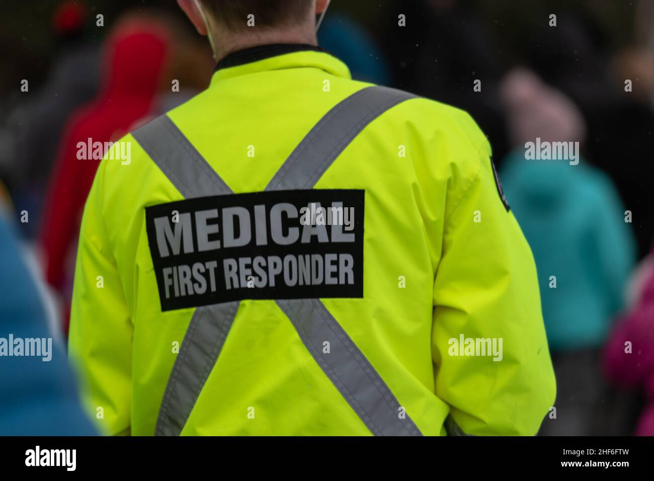 Security guard wearing yellow jacket patrol in hires stock photography