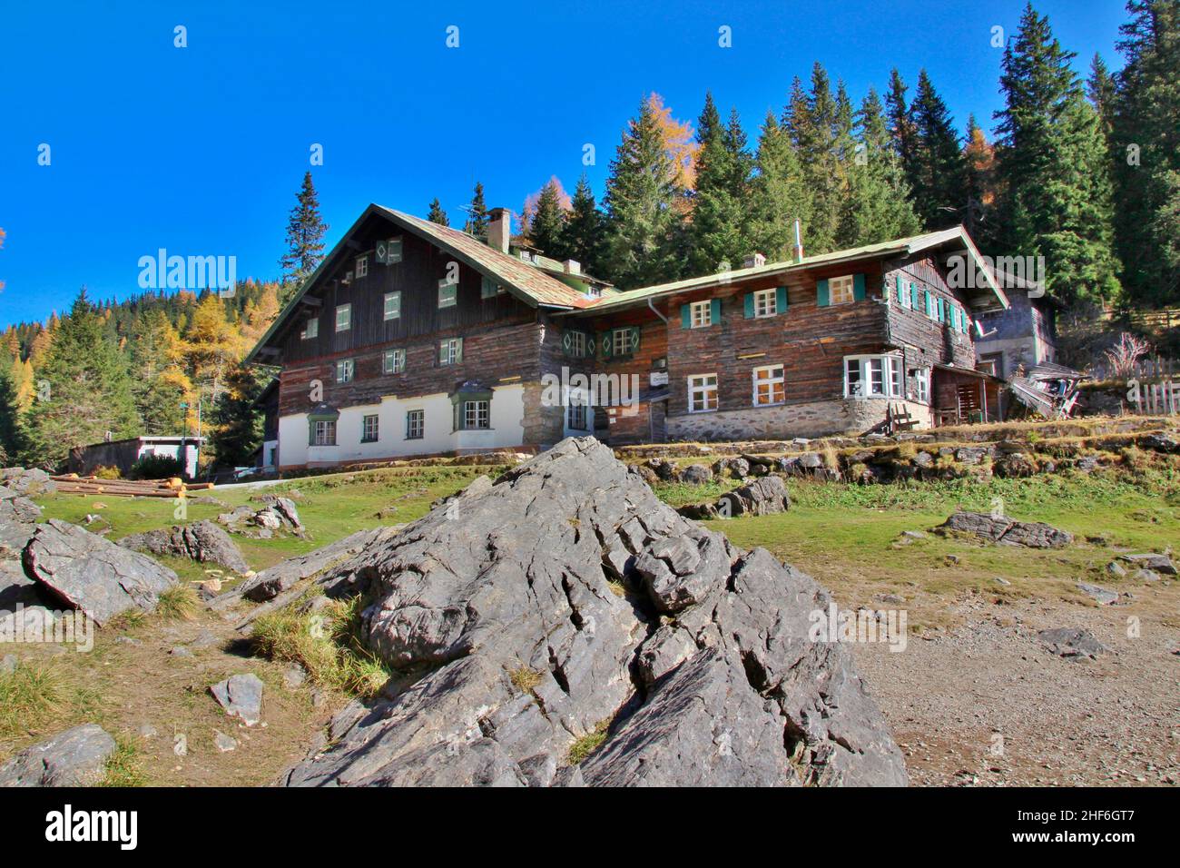 Gasthaus Obernberger See,  Austria,  Tyrol,  Wipptal,  Obernberg am Brenner,  rock in the foreground Stock Photo