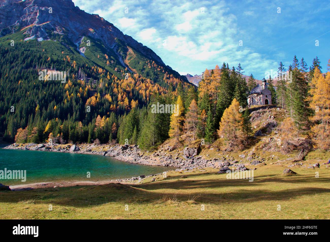 Austria,  Tyrol,  Wipptal,  Obernberg am Brenner,  Obernberger See,  mountain lake,  blue water,  Roman Catholic chapel of Our Lady on the Lake (also: Maria am See) Stock Photo