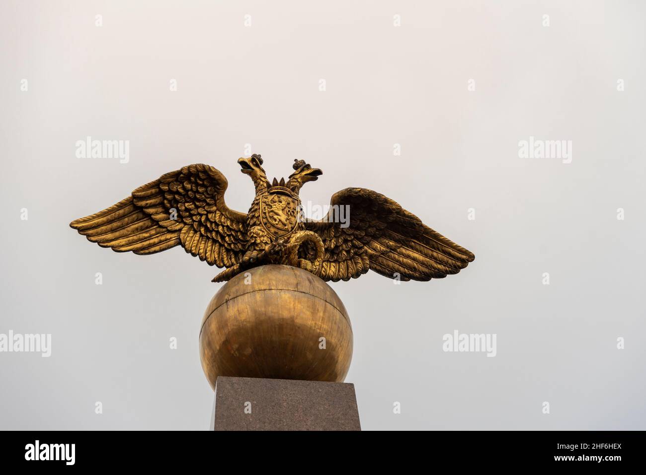 Helsinki,  Finland,  Stele of the Empress,  Keisarinnankivi,  consists of a double-headed eagle perched on a golden ball. Monument commemorates the visit of the Russian Tsarina Alexandra Feodorovna to Helsinki. Stock Photo