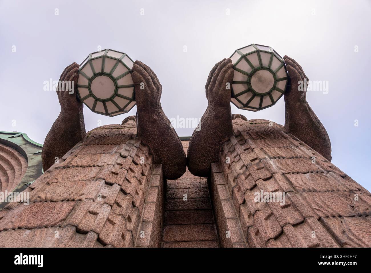 Finland,  Helsinki,  torchbearers at the Central Station,  granite figures by Emil Wikström. Stock Photo