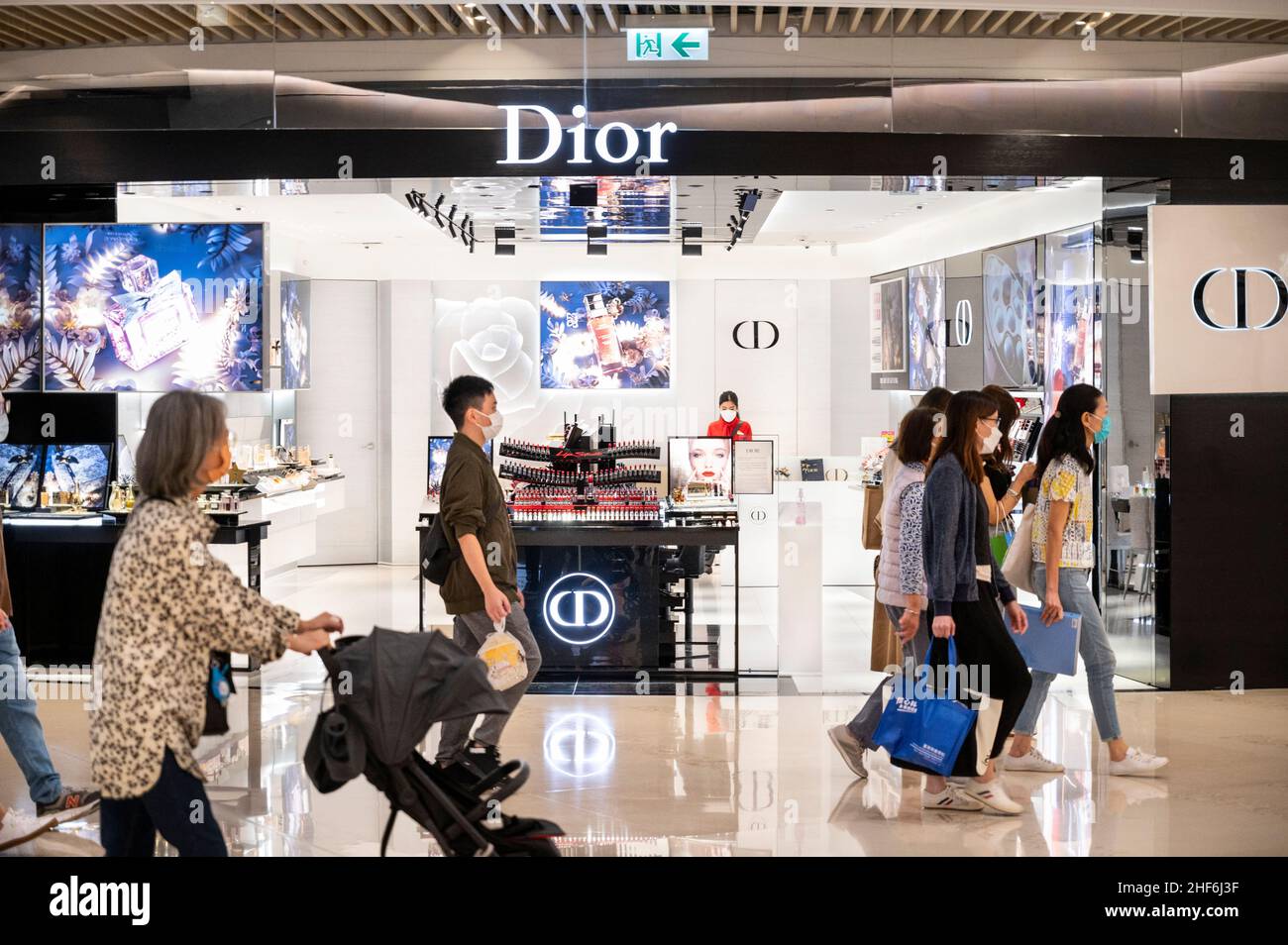 Shoppers walk past the French Christian Dior luxury goods clothing and beauty products store in Hong Kong. Photo by Budrul Chukrut SOPA Images Sipa USA Stock Photo Alamy