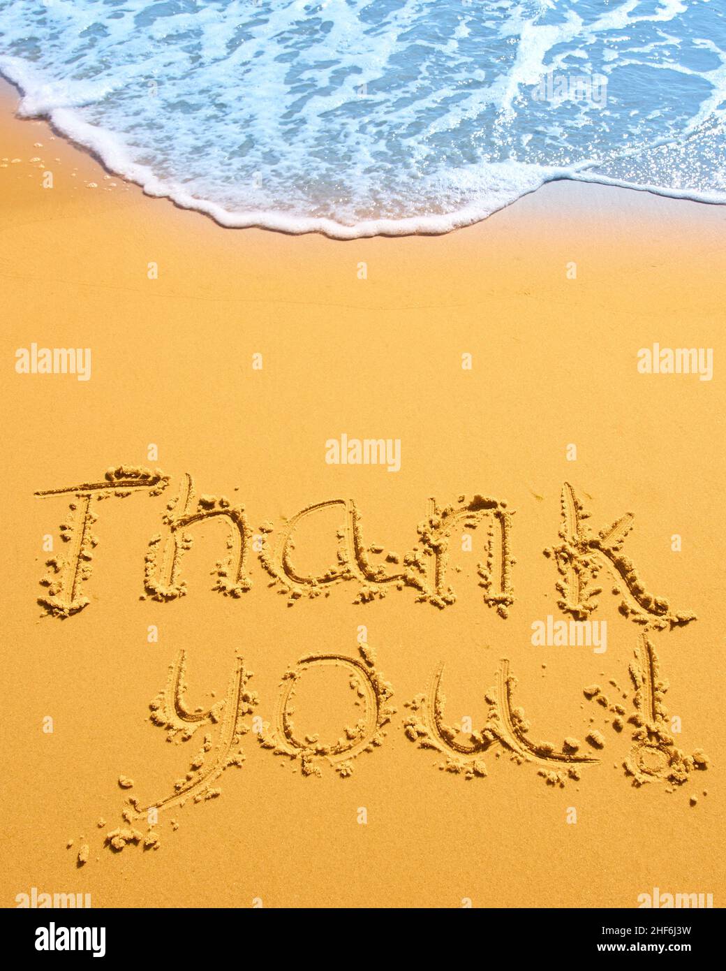 Thank you written in the sand on the beach. conceptual designs Stock ...