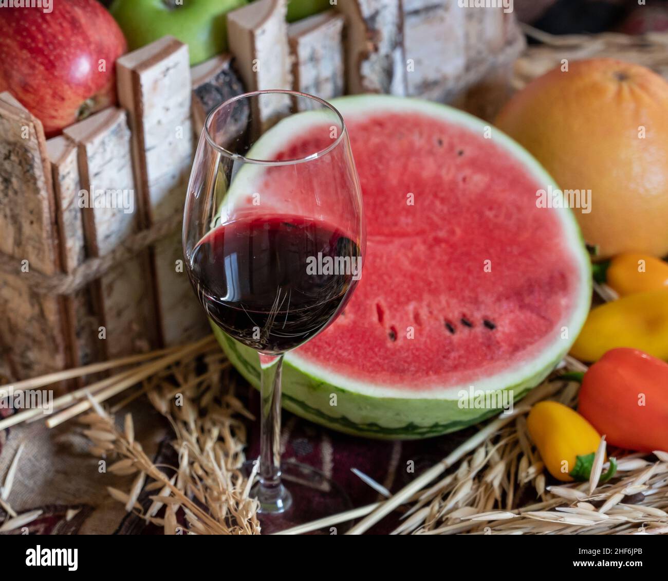 Still life with red wine and watermelon Stock Photo - Alamy