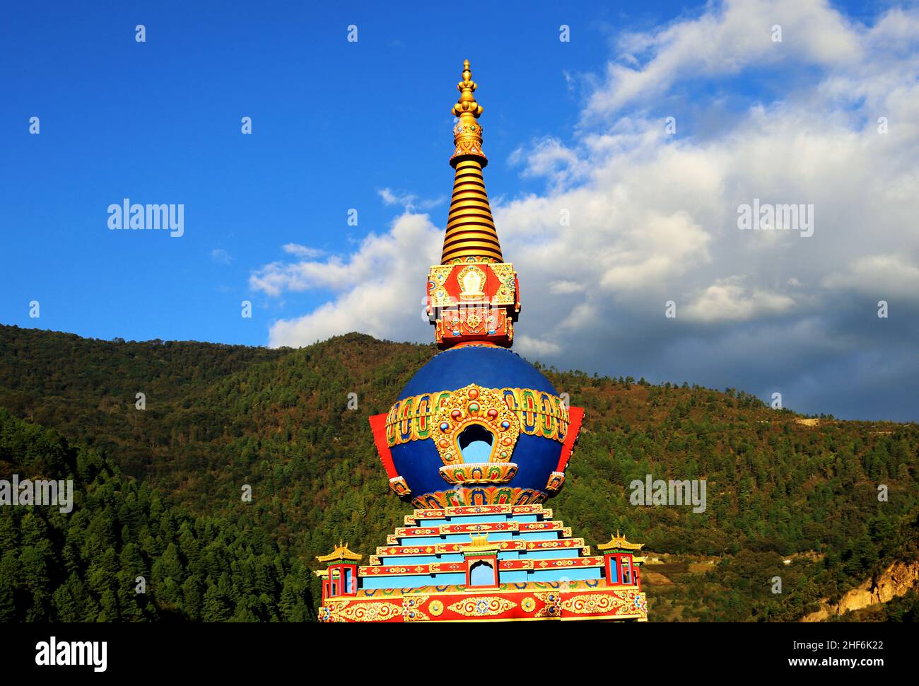 Buddhist stupa with himalayan mountain with blue sky background at Dirang Buddha monastery,Tourist attraction of Buddha architecture in Arunachal prod Stock Photo