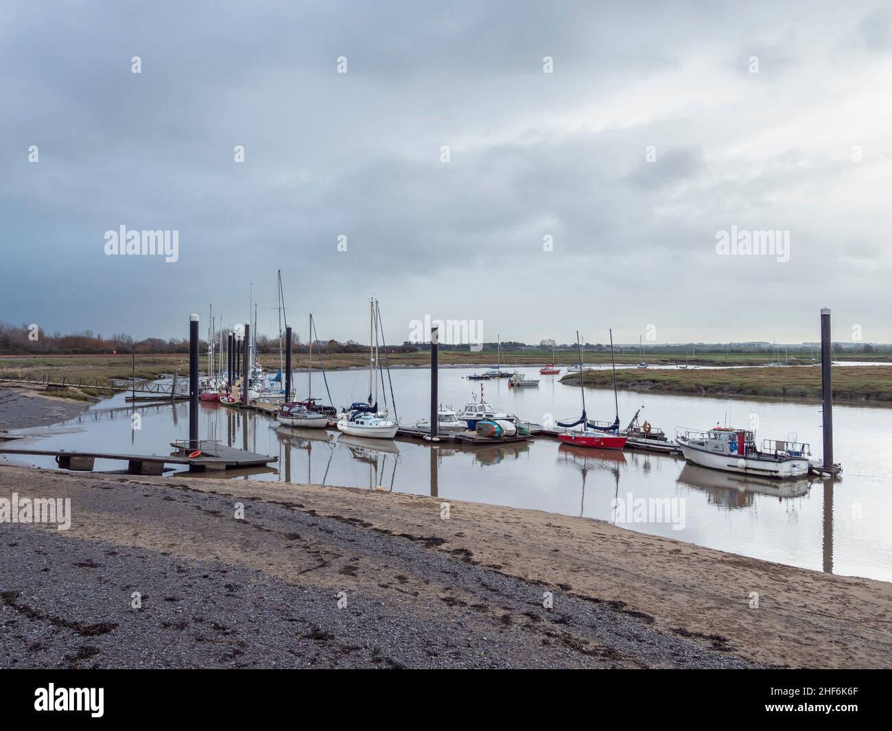 Boats moored on the River Brue by the Burnham-on-Sea Motor Boat and Sailing Club. Burnham-on-Sea, Somerset Stock Photo