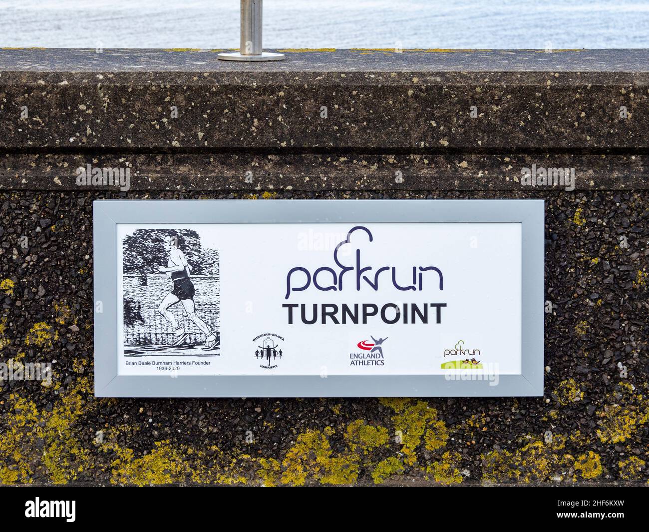 A 'Parkrun' turn point sign on the sea wall. The Esplanade, Burnham-on-Sea, Somerset, England Stock Photo