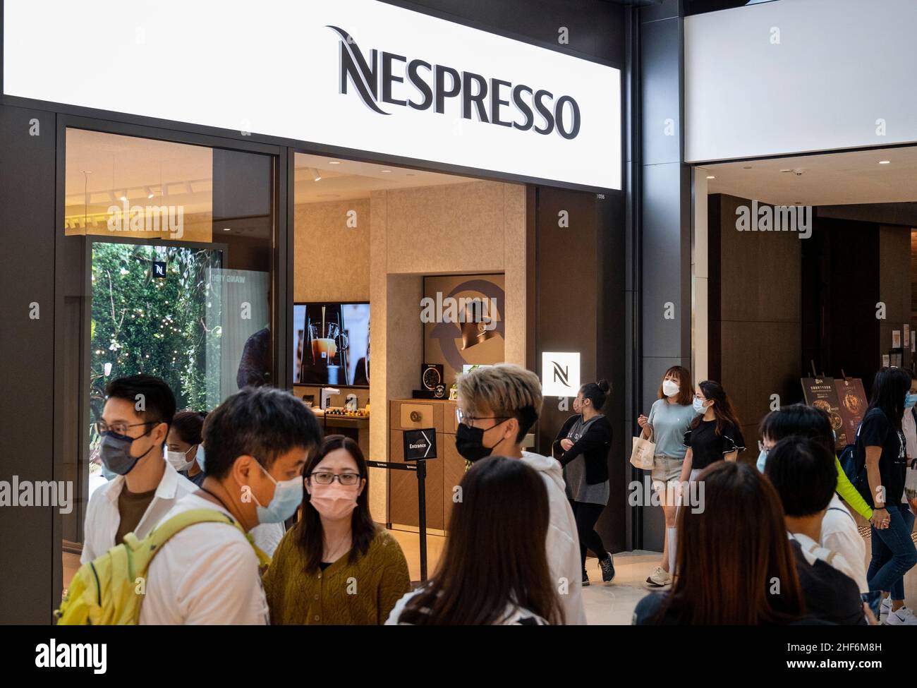 Hong Kong, China. 21st Nov, 2021. Shoppers walk past the Swiss high-end and world leader in coffee capsules brand store Nespresso in Hong Kong. (Credit Image: © Budrul Chukrut/SOPA Images via ZUMA Press Wire) Stock Photo