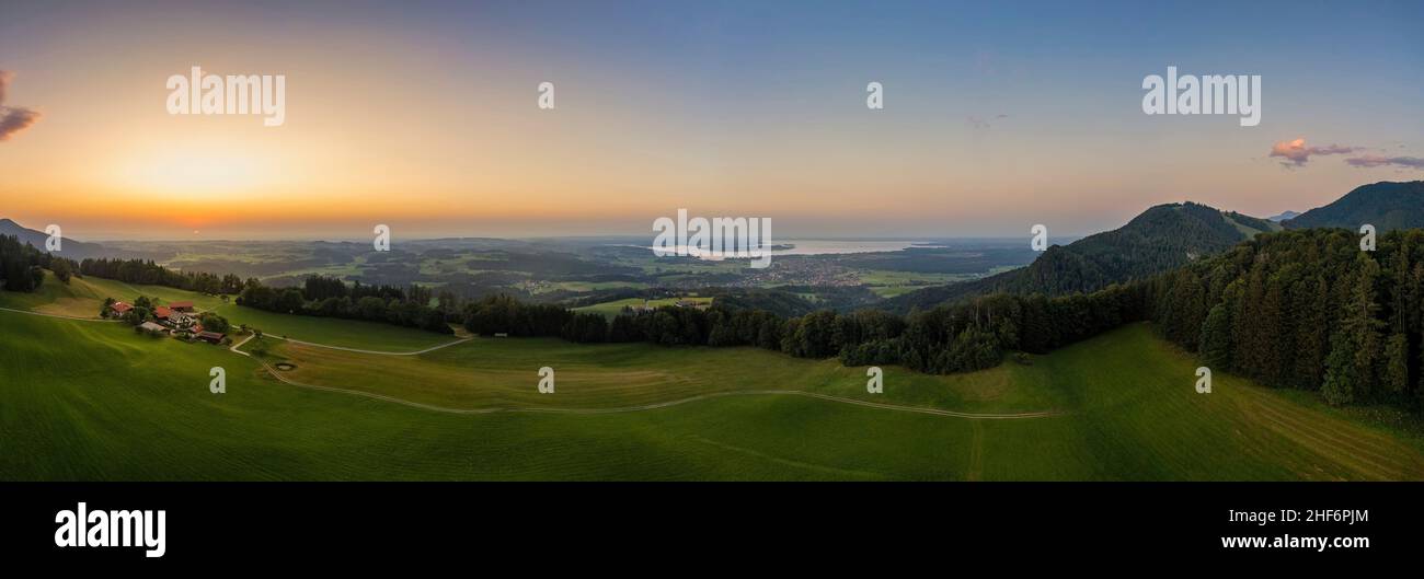 A breathtaking sunset over the popular bavarian Chiemsee next to the alps mountains. Wonderful holiday destination at summertime Stock Photo