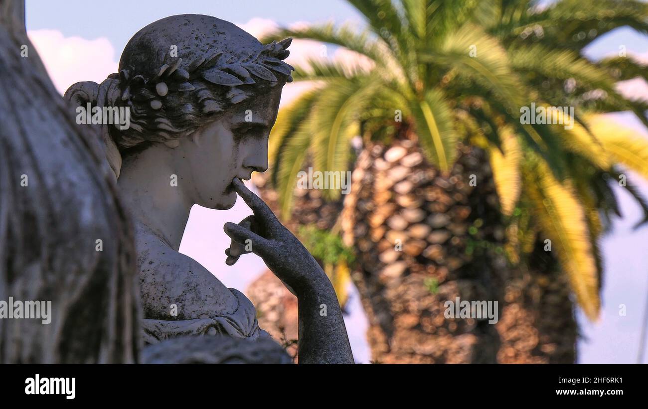 Greece,  Greek Islands,  Ionian Islands,  Corfu,  Achilleion,  residence of Empress Sissis,  built in 1889,  architecture based on Greek mythology,  terrace,  marble head of the nine muses,  a palm tree can be seen out of focus in the background Stock Photo