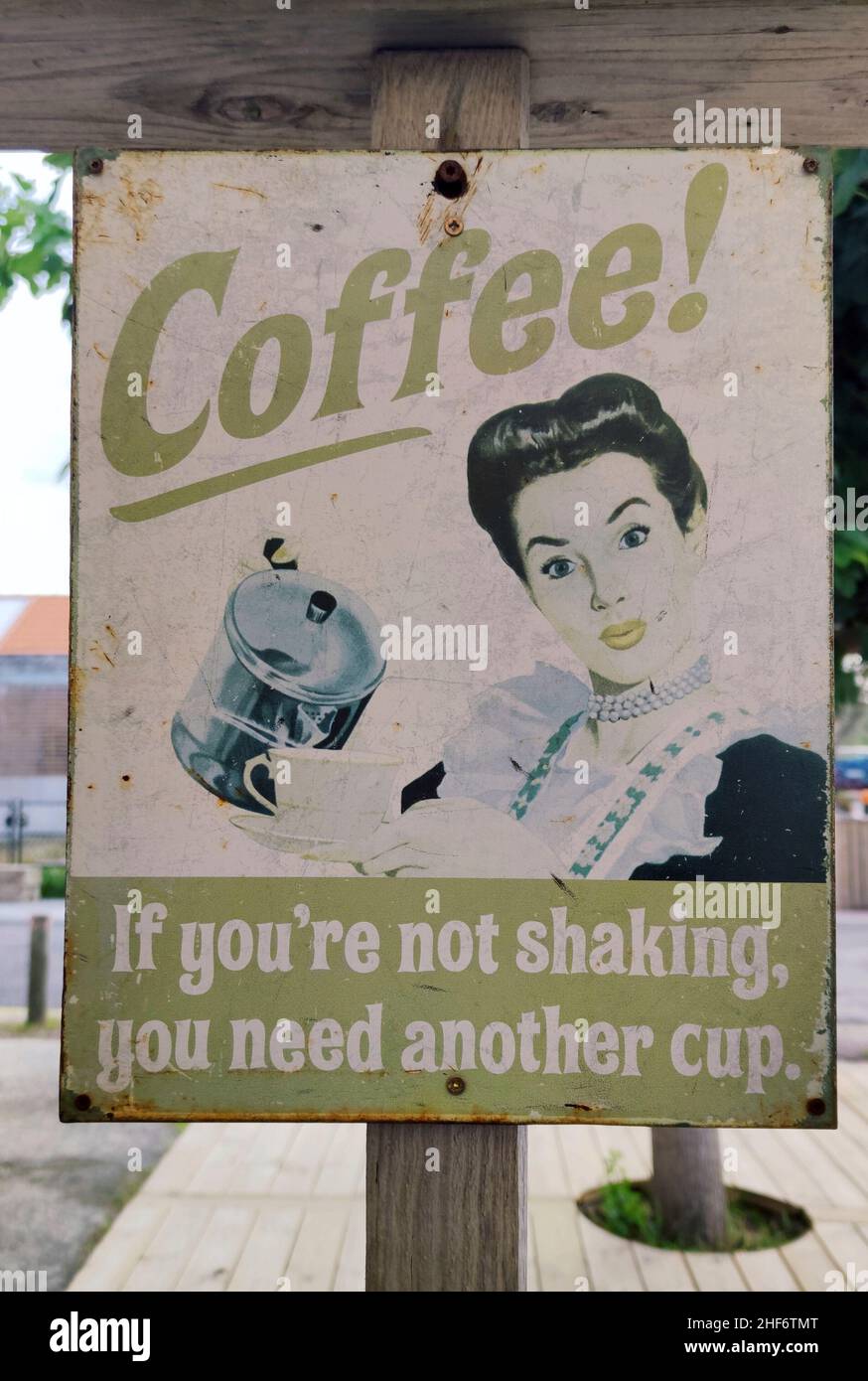 old advertising sign for coffee with picture and writing 'If you don't shiver,  you need another cup' in Montalivet les Bains,  Cote d'Argent region,  French Atlantic coast Stock Photo
