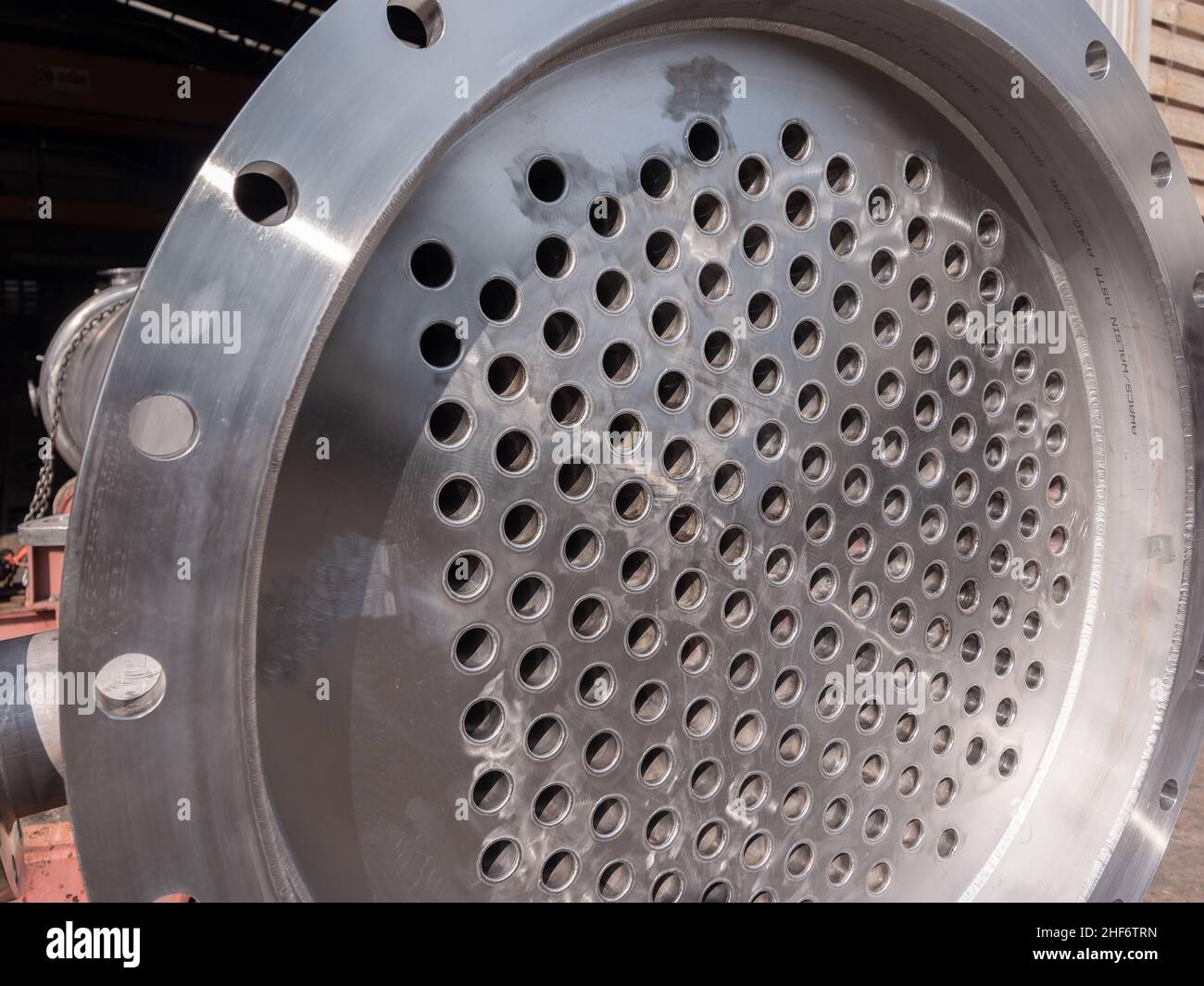 End plate of a shell and tube condenser at an industrial workshop. The image can also be used to illustrate a waste heat evaporator, since they are mo Stock Photo
