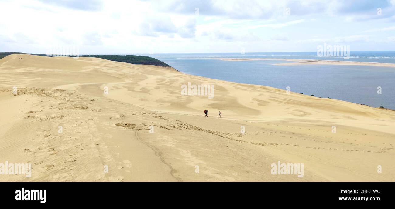 The Dune du Pilat (also Grande Dune du Pilat) on the Atlantic coast near Arcachon (France) is the highest migrating dune in Europe. It has a north-south course and is up to 110 meters high (81 meters according to SRTM data),  500 meters wide,  about 2.7 kilometers long (estimated volume 60 million cubic meters) and lies at the sea opening of the Bassin d ' Arcachon Stock Photo
