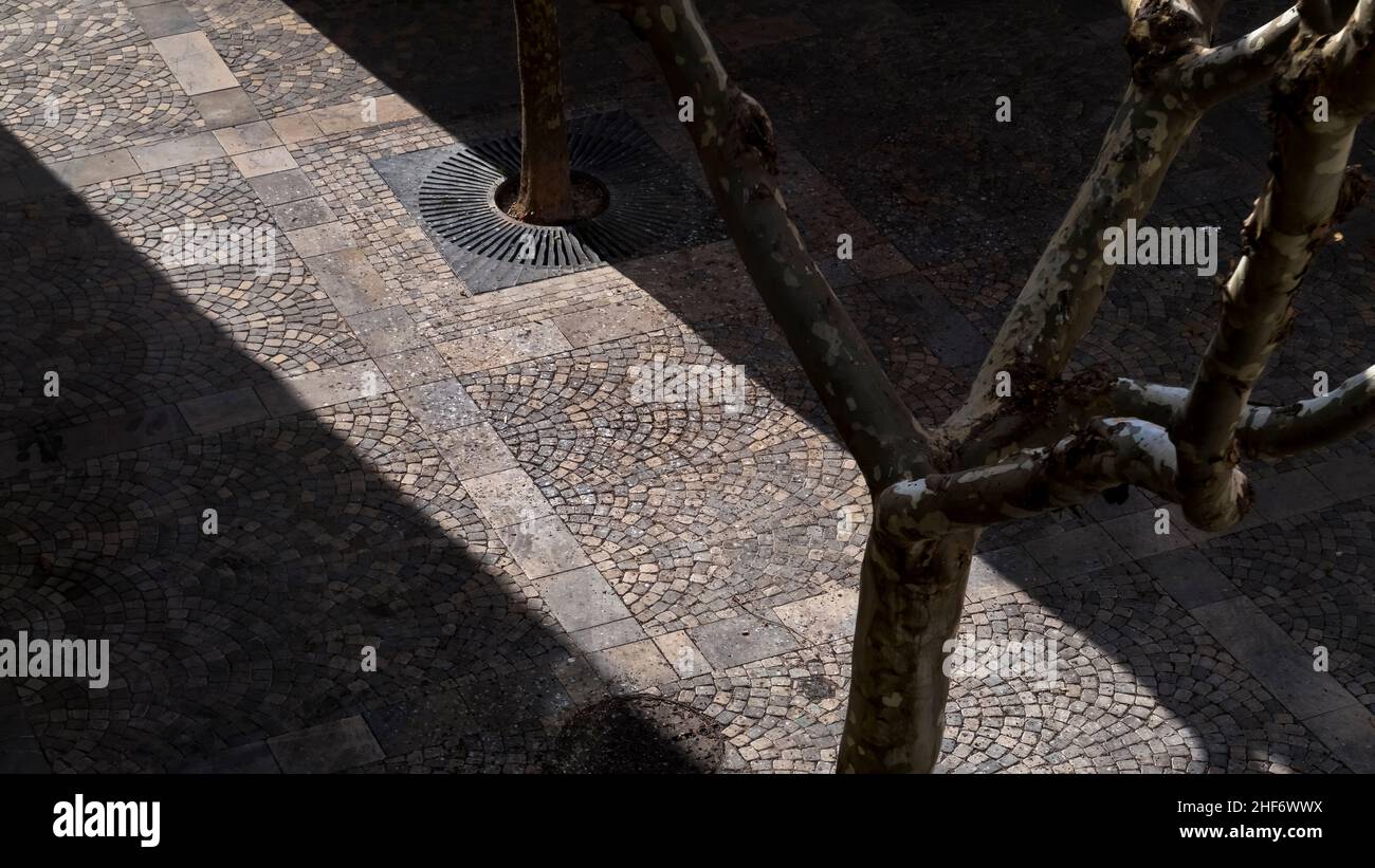 Shadows over Place Auguste Tailhades in Coursan. Stock Photo