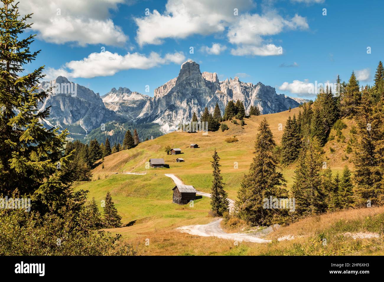 Italy,  South Tyrol,  Bolzano province,  Corvara in Badia,  alpine landscape with wooden huts at the Incisa meadows,  in the peaks of the Puez group,  Dolomites Stock Photo