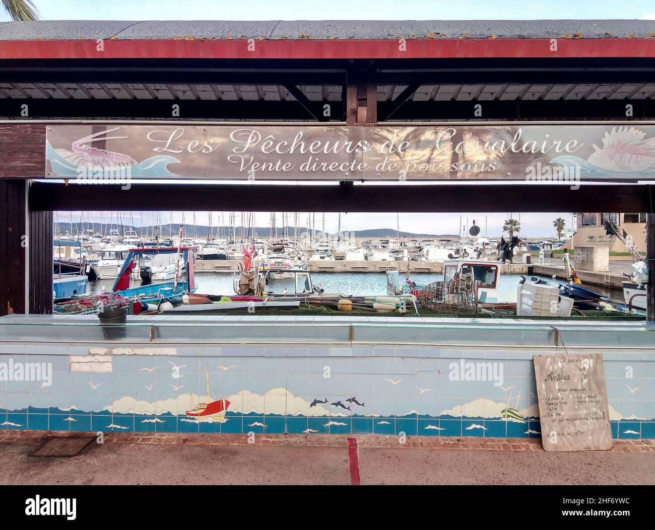Fish hall in front of fishing boats. Port in the south of France Stock ...