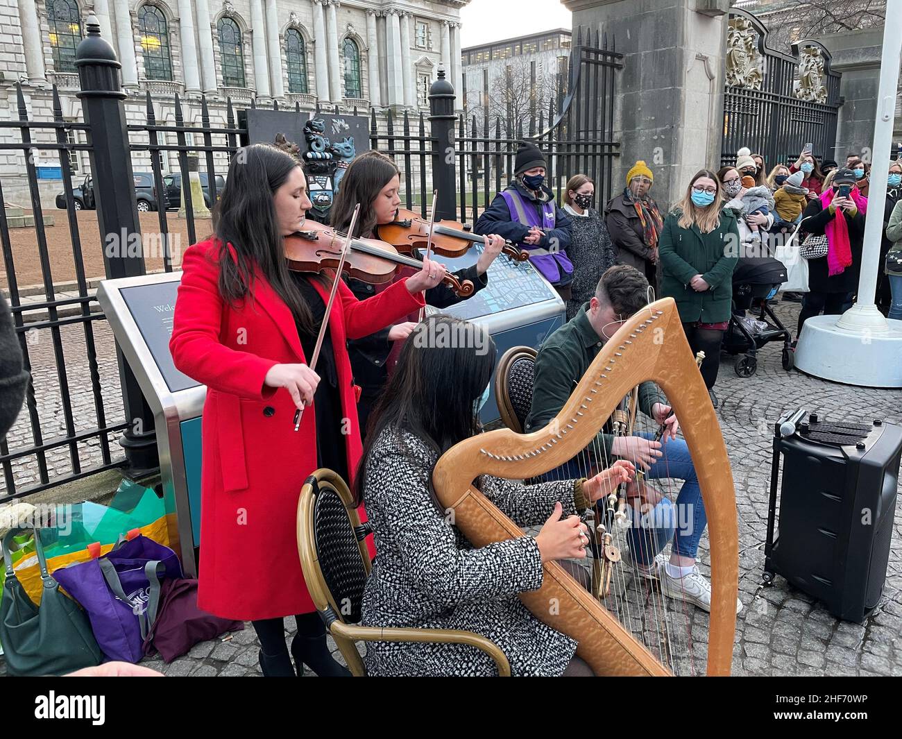 Musicians play as hundreds of people attend a vigil in memory of