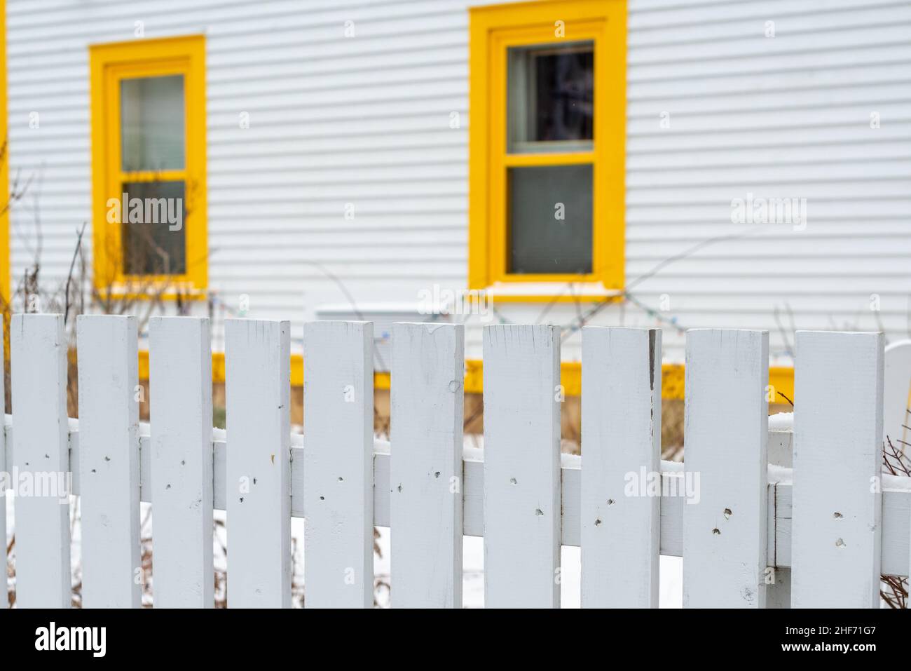 The exterior of a white cape cod clapboard horizontal wooden board ...