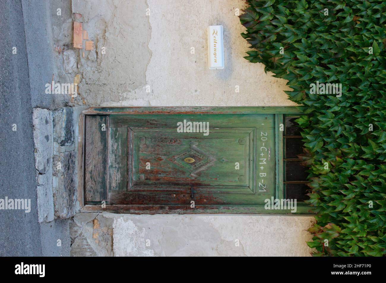 a house entrance overgrown with wild wine,  door,  in Absam,  Tyrol,  Austria Stock Photo