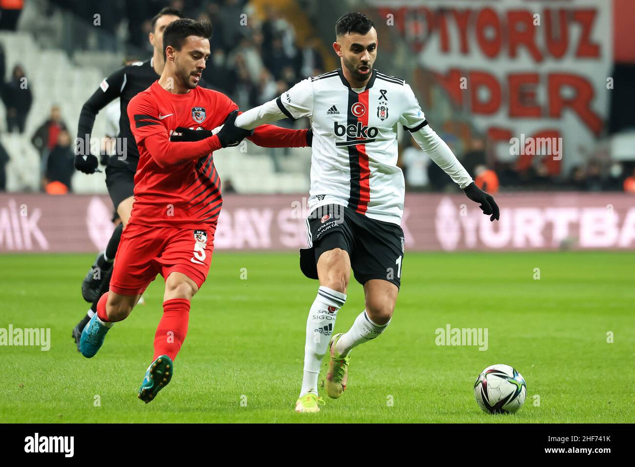 Istanbul, Turkey. 14th Jan, 2022. ISTANBUL, TURKEY - JANUARY 14: Furkan  Soyalp of Gaziantep FK challenges Rachid Ghezzal of Besiktas JK during the  Turkish Super Lig match between Besiktas and Gaziantep FK