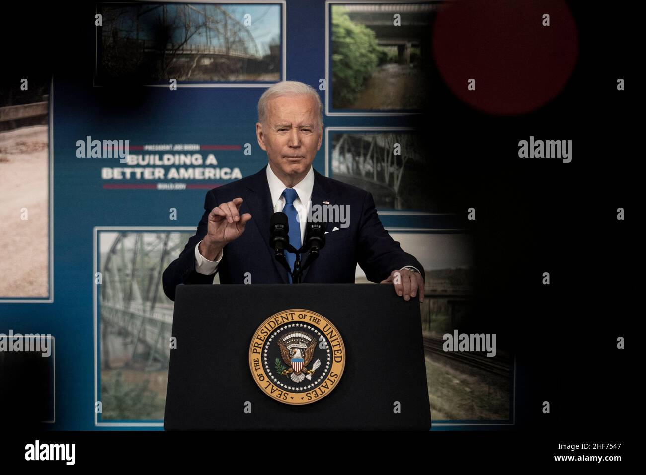 U.S. President Joe Biden announces how the Bipartisan Infrastructure Law will rebuild America’s bridges in the South Court Auditorium of the Eisenhower Executive Office Building near the White House in Washington, DC on Friday, January 14, 2022. Biden also provided an update on the progress made by his Administration in the 60 days since he signed the Bipartisan Infrastructure Law. Photo by Ken Cedeno/Pool/ABACAPRESS.COM Stock Photo