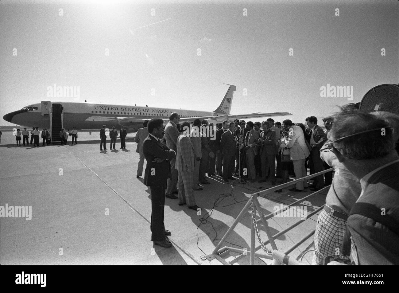 Secretary of State Henry Kissinger Addressing Reporters at Andrews Air Force Base Prior to His Departure on a Diplomatic Trip to Africa Stock Photo