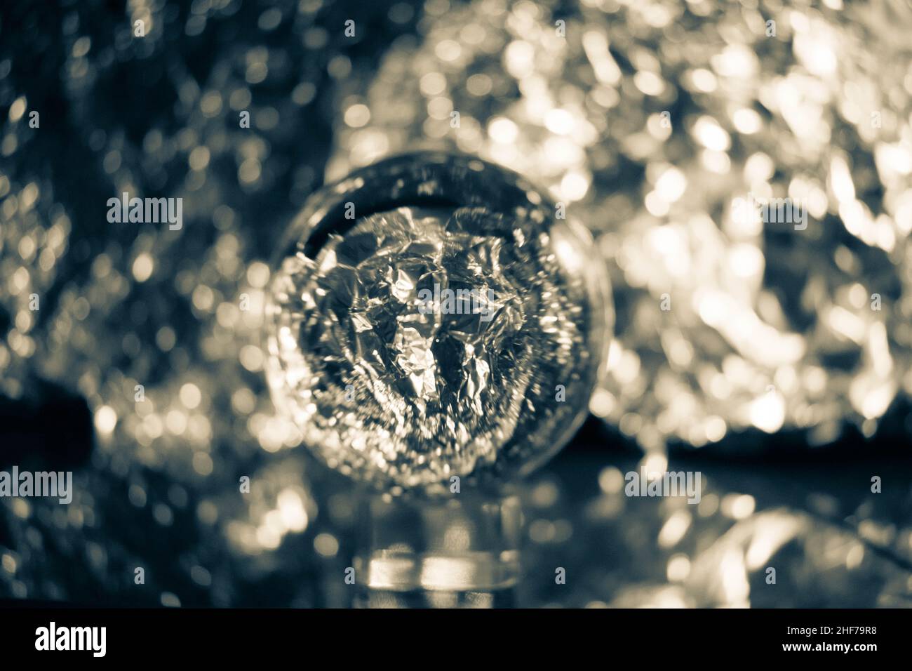 Snow globe photography crystal ball transparent lens on a blurred background, very artistic, futuristic, colourful, vibrant. Cool background and backd Stock Photo