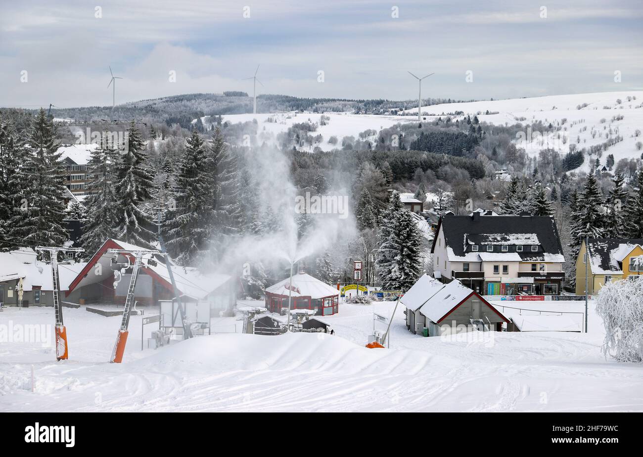12 January 2022, Saxony, Oberwiesenthal: From numerous lances, the slope at the long drag lift is covered with snow. On Saturday, 15.01.2022, this year's ski season will be officially ushered in at Fichtelberg. Due to Corona, the ski area is only open to vaccinated and recovered skiers (2G), and a mask must be worn when queuing at the lift and in the lift itself. The 2G status is checked before purchasing the ski pass as well as in the ski resort. For this purpose, a control point and a central sales point for lift tickets will be set up in the parking lot of the Fichtelberg cable car. Photo: Stock Photo