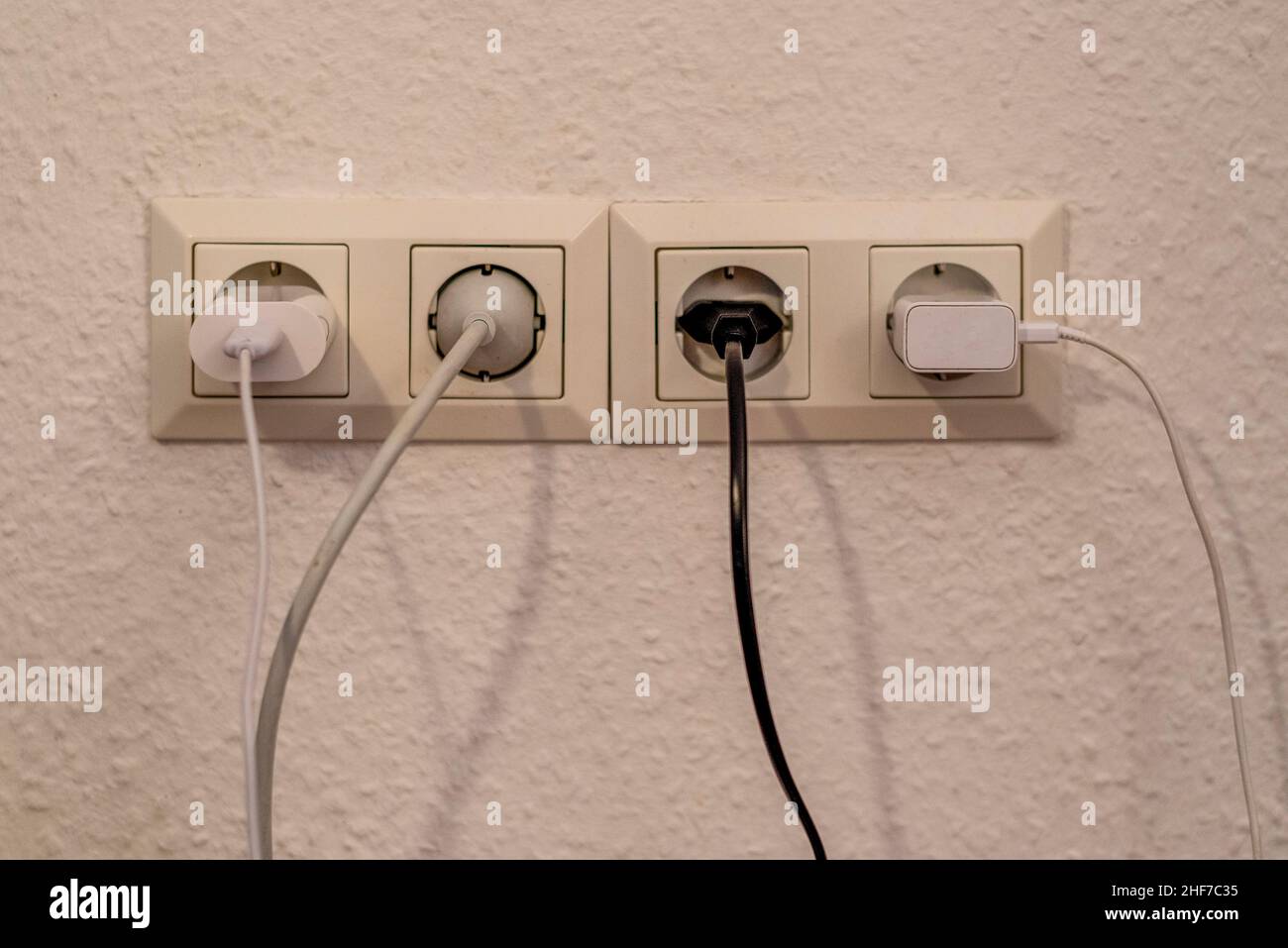 Four occupied sockets. Stock Photo
