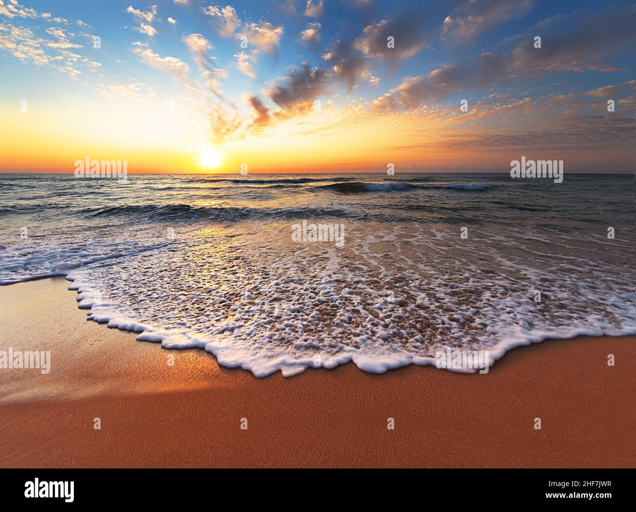 Beautiful tropical sunrise on the beach Stock Photo - Alamy