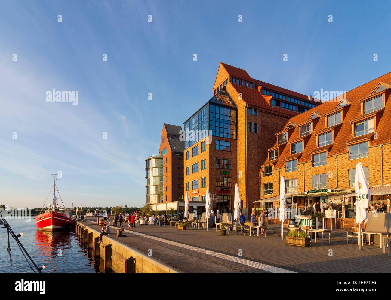 Rostock,  fish snack seller from fishing ship,  commercial buildings in the eastern part of the city harbor in the style of the warehouse buildings in Ostsee (Baltic Sea),  Mecklenburg-Vorpommern,  Germany Stock Photo