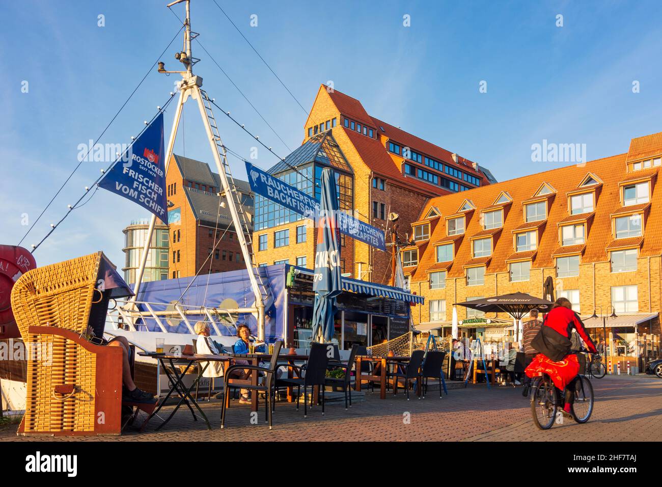 Rostock,  Stadthafen (city harbor),  fish snack seller from fishing ship,  commercial buildings in the eastern part of the city harbor in the style of the warehouse buildings in Ostsee (Baltic Sea),  Mecklenburg-Vorpommern,  Germany Stock Photo