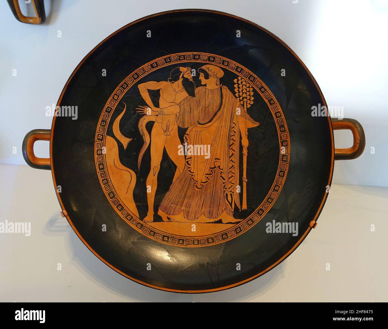 Satyr and maenad, with Dionysos, satyrs, and maenads, kylix, by Douris or the Painter of London E55, Attic Greek, 490-480 BC, red-figure terracotta Stock Photo