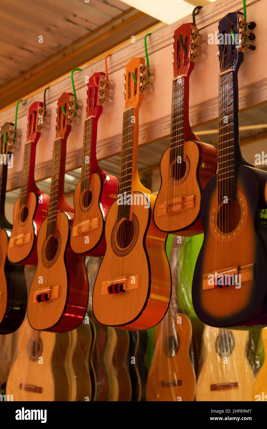 beautiful handmade mexican guitars hung for sale in a local market in